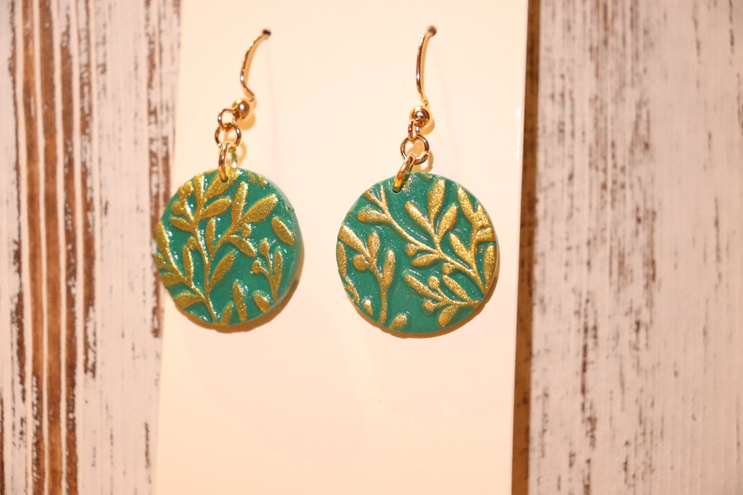 Delicate gold leaf design earrings