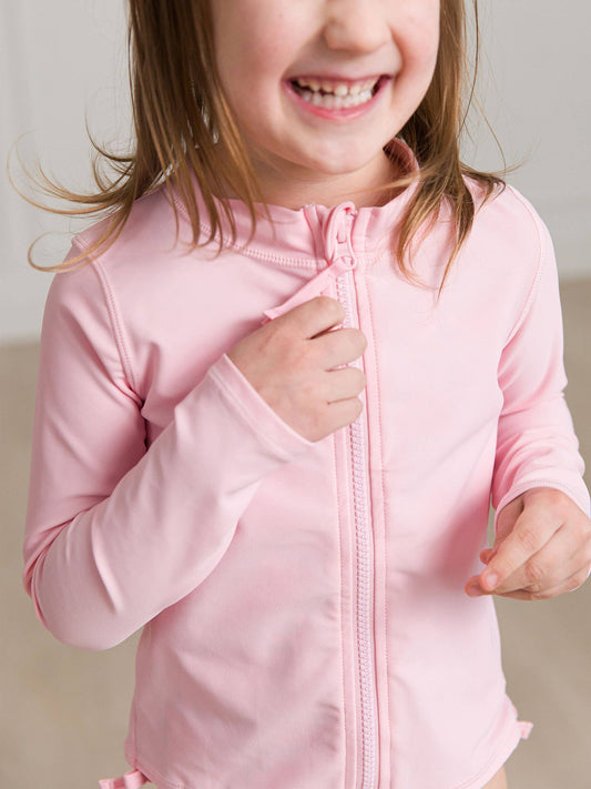 RuffleButts + RuggedButts - Kids Pink Long Sleeve Full Zip Rash Guard